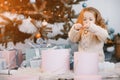 Little blonde baby girl helping decorate