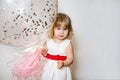 Little blonde baby girl two years old with big pink and white balloons on her birthday party Royalty Free Stock Photo