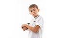 A little blonde boy holds soccer ball, picture isolated on white background Royalty Free Stock Photo