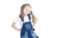 Little blonde girl in blue overalls