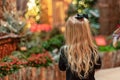 Little blonde girl looking at holiday lights Royalty Free Stock Photo