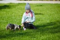 Little blonde girl and a loving puppy dachshund