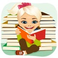 Little blonde girl reading an interesting book