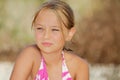 Little blonde girl in swimsuit on the beach Royalty Free Stock Photo