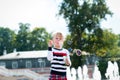 Little blondy girl playing with soap bubbles in summer park Royalty Free Stock Photo