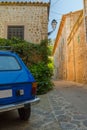 A little blue car in the back streets of Biniaraix Royalty Free Stock Photo