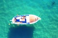 Little boat on clear turquoise water, sea or ocean, top view Royalty Free Stock Photo