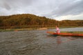 Little boat floating along the water.