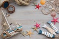 Little boat, starfish and compass on gray background. Time of sailing.