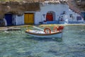 Little boat in traditional harbor in Milos