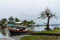 Little boat waiting on pier in Brazil on a rainy day