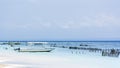 Little boat on the water on the beach with blue sky in the background Royalty Free Stock Photo