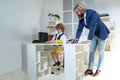 Little boss. Group of four business colleagues in suits working on project. Little Businessman bossy child working in Royalty Free Stock Photo