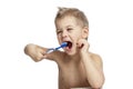 The little boy is actively brushing his teeth. Close-up. Isolated over white background Royalty Free Stock Photo