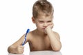 The little boy is actively brushing his teeth. Close-up. Isolated over white background Royalty Free Stock Photo