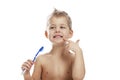 The little boy is actively brushing his teeth. Close-up. Isolated over white background Royalty Free Stock Photo