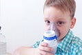 Little boy with asthma problems making inhalation with mask on her face. Medicine, respiratory infection Royalty Free Stock Photo