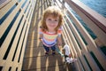 Little Boy baby child walking with dog in the park. Pet with owner. Wide angle. Funny kids face. Royalty Free Stock Photo