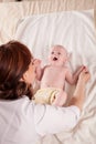 The little boy baby mother doing massage hands and legs Royalty Free Stock Photo