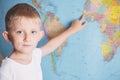 Little boy on the background of a world map Royalty Free Stock Photo