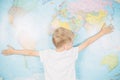 Little boy on the background of a world map Royalty Free Stock Photo