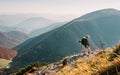 Little Boy backpacker traveler walking up on mountain top in High Tatra mountains