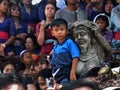 Little Boy And Balinese Statue Royalty Free Stock Photo