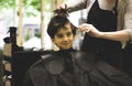 Little boy in the barber shop hair cut professional Royalty Free Stock Photo