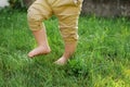 Little boy bare feet walk on fresh green grass Royalty Free Stock Photo