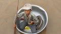 A little boy in a basin on Lake Tonle Sap Royalty Free Stock Photo