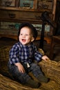 Little boy in a basket of rustic rural Provence