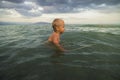 Little boy bathes in the sea Royalty Free Stock Photo