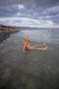 Little boy bathes in the sea Royalty Free Stock Photo