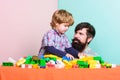 Little boy with bearded man dad playing together. father and son play game. child development. happy family. leisure Royalty Free Stock Photo