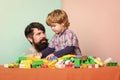 little boy with bearded man dad playing together. father and son play game. child development. happy family. leisure Royalty Free Stock Photo
