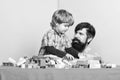 little boy with bearded man dad playing together. father and son play game. child development. happy family. leisure Royalty Free Stock Photo