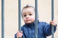 Little boy behind bars Royalty Free Stock Photo