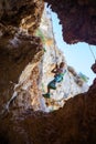 Little boy being lowered down while top rope climbing Royalty Free Stock Photo