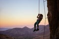 Little boy being lowered down while top rope climbing Royalty Free Stock Photo