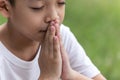 Little boy with Bible praying and close your eyes in praying. Prayer to pray. Children pray with folded hands Royalty Free Stock Photo