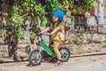 Little boy on a bicycle. Caught in motion, on a driveway motion blurred. Preschool child`s first day on the bike. The