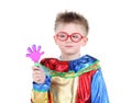 Little boy in big glasses and clown costume holds toy hand Royalty Free Stock Photo