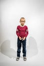 Little Boy With Big Glasses Standing Looking at Camera Against a White Background Royalty Free Stock Photo