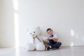 Little boy with big soft bear toy Royalty Free Stock Photo