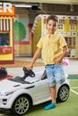 Little boy with a big toy car looking at camera. Royalty Free Stock Photo