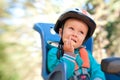 Little boy in bike child seat