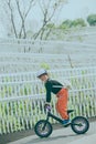 The little boy on the bicycle turns his head and looks over here Royalty Free Stock Photo