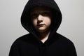 Little boy in black hoodie. Close-up portrait of teenager boy