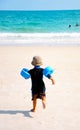 A little boy run to the beach