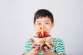 Little boy blowing candle on the cake for his birthday Royalty Free Stock Photo